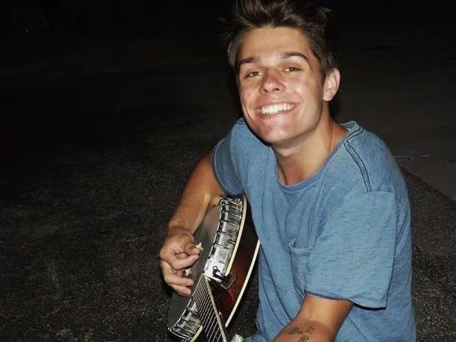 Cole Rassin with guitar